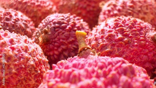 Принти на полотні Get up close and personal with lychees as the camera zooms in on their rugged, reddish-brown skin