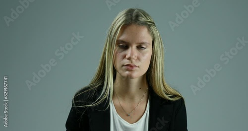 Listens seriously, smiles after understanding speaker