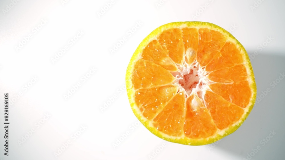 Bursting with vitality, the close-up captures the glistening flesh of a freshly cut half orange, exuding freshness and allure through its radiant orange hues. Orange background.
Bursting with vitality, the close-up captures the glistening flesh of a freshly cut half orange, exuding freshness and allure through its radiant orange hues. Orange background.