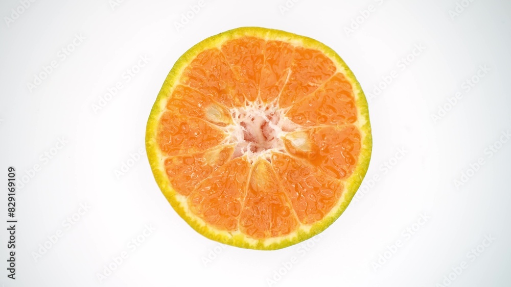 A radiant half orange gleams, revealing its succulent, pulpy texture. The vibrant hues and juicy segments evoke a sense of freshness and natural allure. Orange background.
A radiant half orange gleams, revealing its succulent, pulpy texture. The vibrant hues and juicy segments evoke a sense of freshness and natural allure. Orange background.