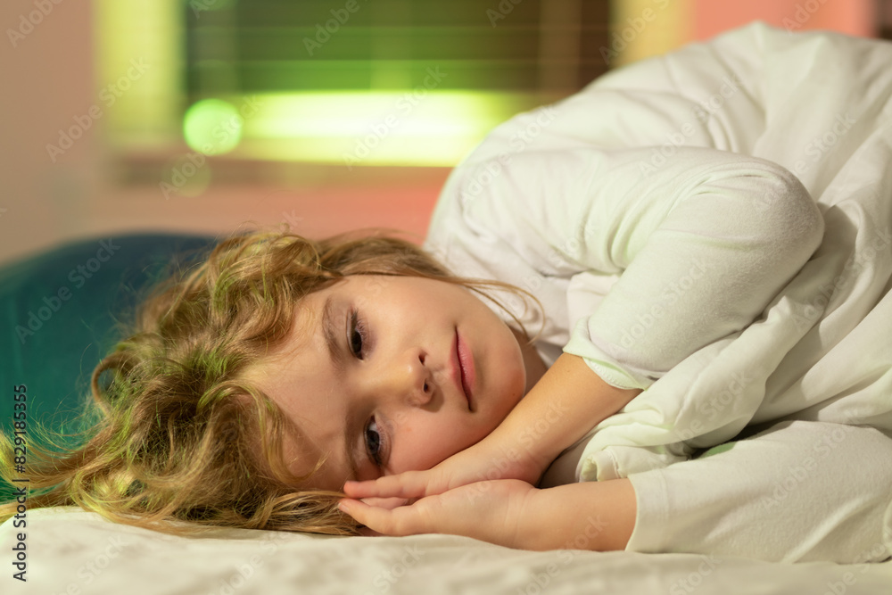 Cute boy trying to fall asleep. Night fall asleep of little child in bed. Kid go to sleep in the bedroom. Cute boy trying to fall asleep. Night fall asleep of little child in bed. Kid go to sleep in the bedroom.