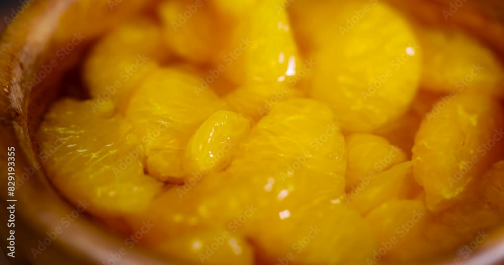 canned peeled tangerines in sugar syrup, ripe small slices of tangerines in sweet syrup canned peeled tangerines in sugar syrup, ripe small slices of tangerines in sweet syrup