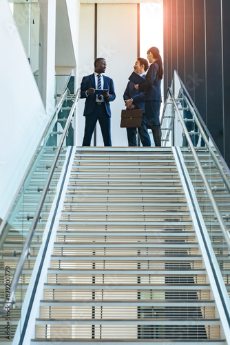 Group of multinational business people having a conversation in a lobby