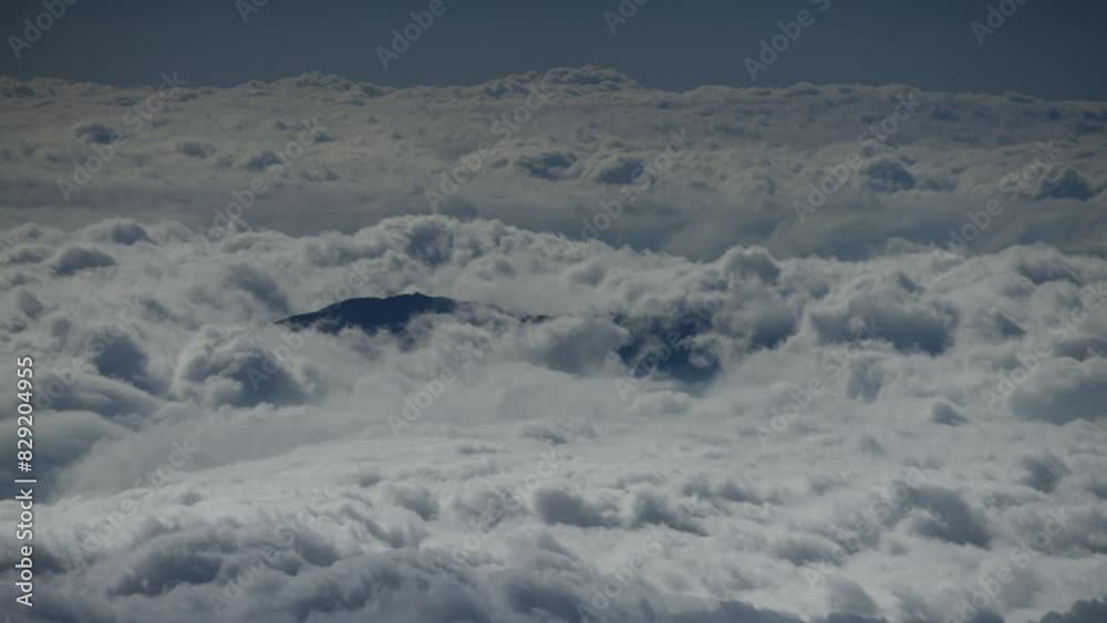 Clouds blanket the landscape viewed from Haleakala mountain, Maui Clouds blanket the landscape viewed from Haleakala mountain, Maui