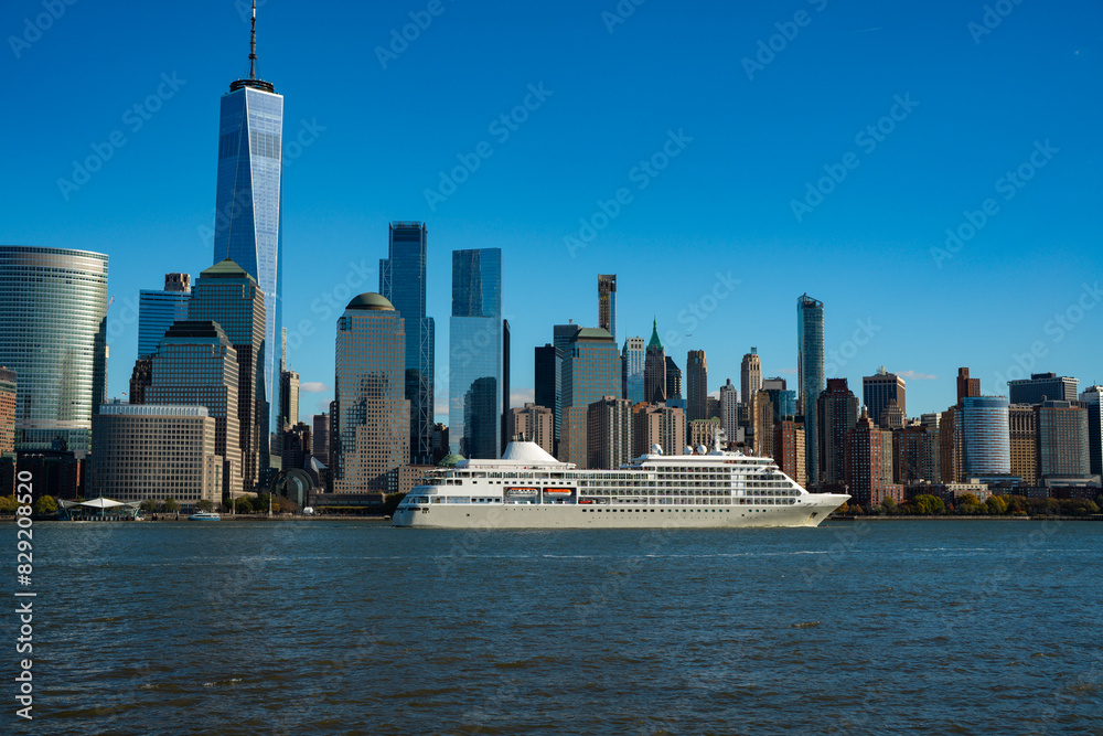 Fototapeta premium The city skyline of New York City in USA, United States. Blue sky day with iconic buildings. New York City NYC Manhattan Downtown Skyline, viewed from Jersey City, USA.