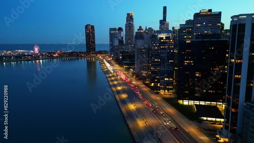 Drone shot of a busy Lake Shore Drive in Chicago, Illinois, filmed as the sun goes down. photo