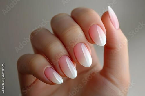 Close-up of a hand showcasing a professional manicure with shiny pink polish, perfect for beauty and fashion concepts.