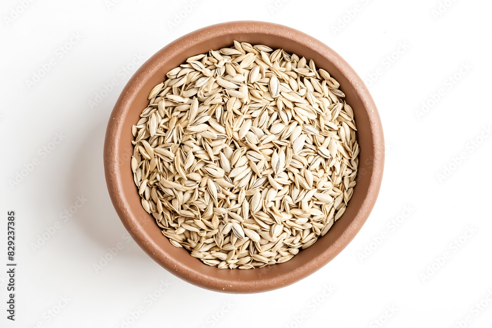 Close-up of a Clay Bowl Filled with Hulled Sunflower Seeds Close-up of a Clay Bowl Filled with Hulled Sunflower Seeds
