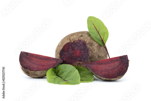 Slices of beetroot and fresh green leaves isolated on white
