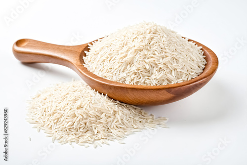 White rice in wooden spoon on white background