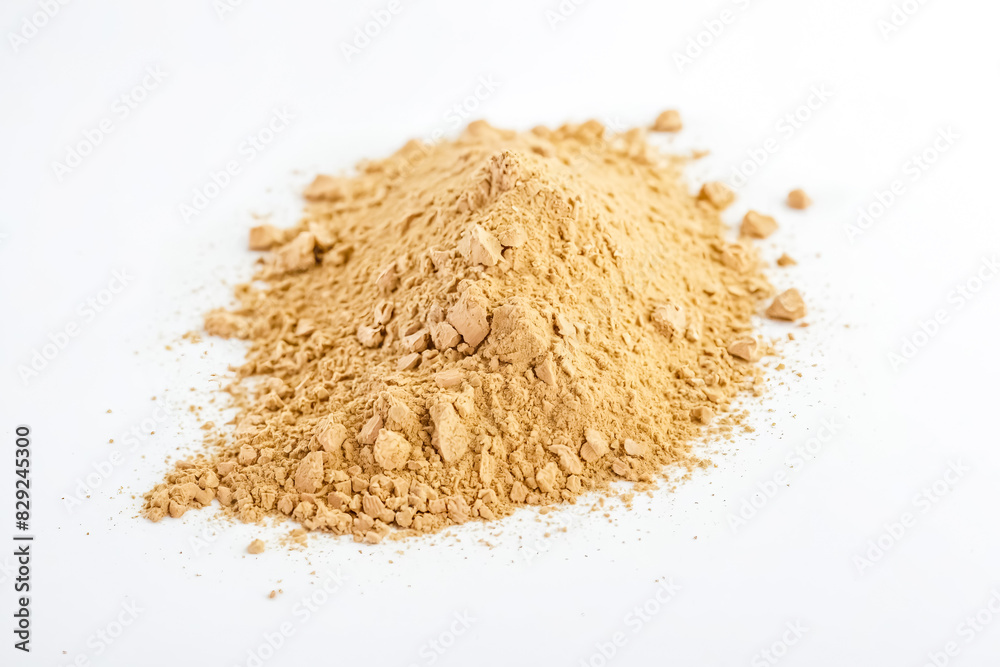 Close-up of a Pile of Beige Powder on a White Background Close-up of a Pile of Beige Powder on a White Background