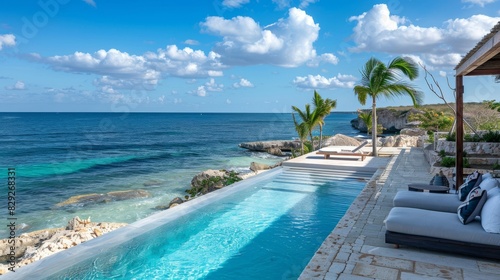 Wallpaper Mural A beachfront retreat with a private pool and cabana overlooking the ocean Torontodigital.ca