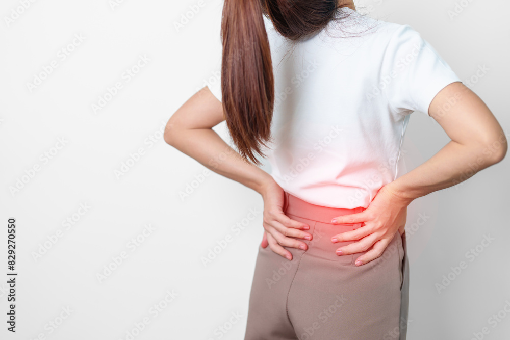adult female with muscle pain on gray background. Elderly woman having back body ache due to Piriformis Syndrome, Low Back Pain and Spinal Compression. Office syndrome and medical concept adult female with muscle pain on gray background. Elderly woman having back body ache due to Piriformis Syndrome, Low Back Pain and Spinal Compression. Office syndrome and medical concept