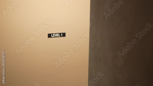 Simple wall with level I sign indoors