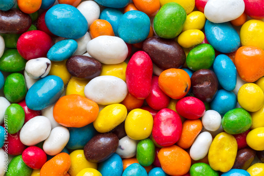 Multi-colored candies. Bright round candies in multi-colored sugar glaze. Multi-colored candies. Bright round candies in multi-colored sugar glaze.