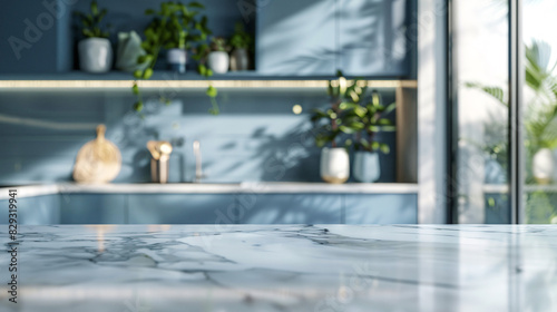 Modern empty white marble table or kitchen island on blue color furniture, blurred bokeh kitchen room interior background. For display of assembly products. photo