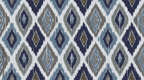  Hand-painted Ikat style diamond-shaped seamless pattern in indigo blue, gray and denim blue on light blue background. A multipurpose for fabric, wallpaper and other printings.