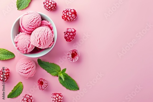 Raspberry sorbet in a cup with mint leaves on a pink background