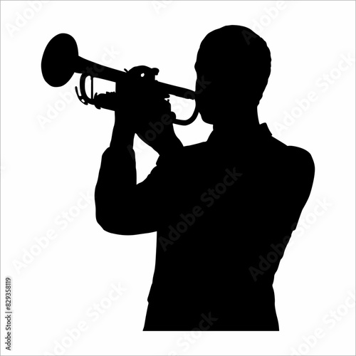 Silhouette of a musician, blowing a trumpet 