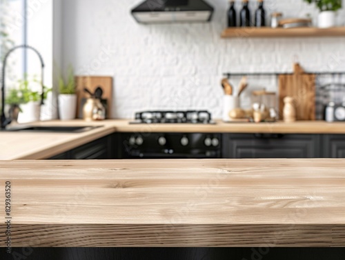 Wooden table top view for product montage over blurred kitchen interior background in a Scandinavian design, with light wood cabinetry, sleek black fixtures, and an emphasis on natural light © Sine