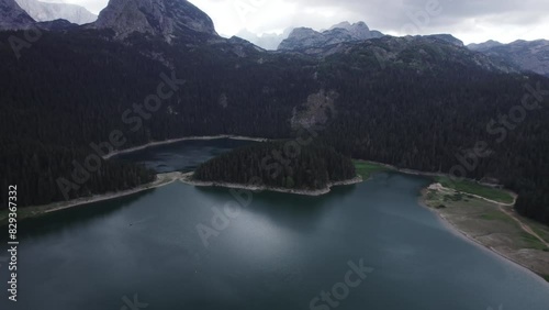 Aerial video, Crno Jezero or Black Lake, pine forest and cliffs in Dormitor National Park, Zabljak photo