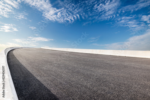 Empty asphalt road and sky clouds background