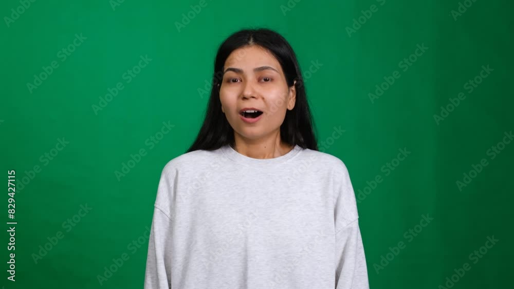 Astonished success. Woman face lights up with surprise and joy, capturing the emotion of shocked excitement and triumph as she celebrates amazing news and victory Astonished success. Woman face lights up with surprise and joy, capturing the emotion of shocked excitement and triumph as she celebrates amazing news and victory