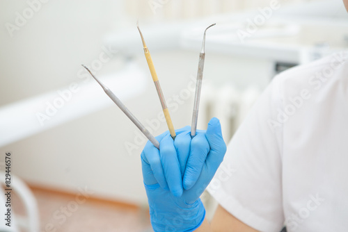 doctor holding a dental instruments