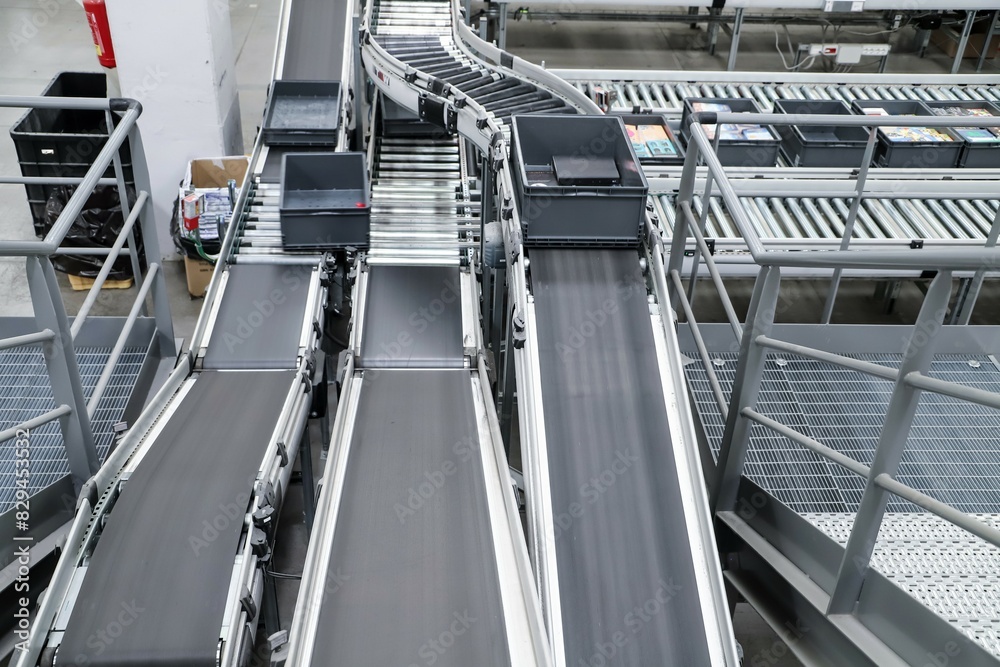 packing line in a logistics warehouse. conveyor belt in a modern production line packing line in a logistics warehouse. conveyor belt in a modern production line