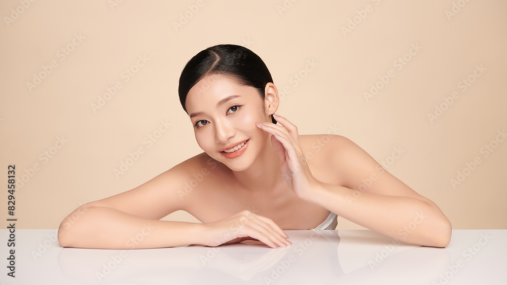 Beautiful young asian woman with clean fresh skin on beige background, Face care, Facial treatment, Cosmetology, beauty and spa, Asian women portrait.