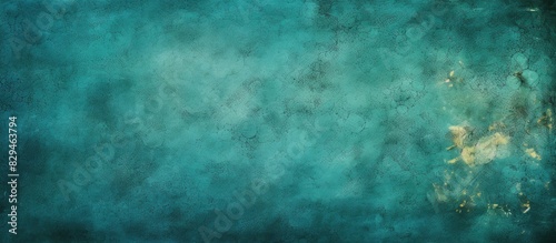 A festive copy space image with a vintage stone texture and abstract grunge decoration on a teal or blue background suitable for Christmas or St Patrick s Day