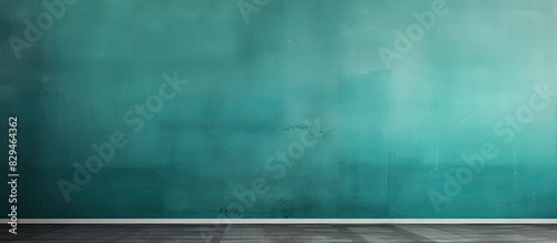 Teal colored panorama wall background with varied textures in shades of teal or petrol providing ample copy space image