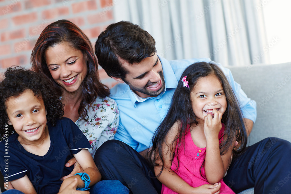 Obraz premium Portrait, happy and family in home living room for care, support and interracial people bonding together to relax. Face, mother and father playing with kids on sofa for love, connection and laughing