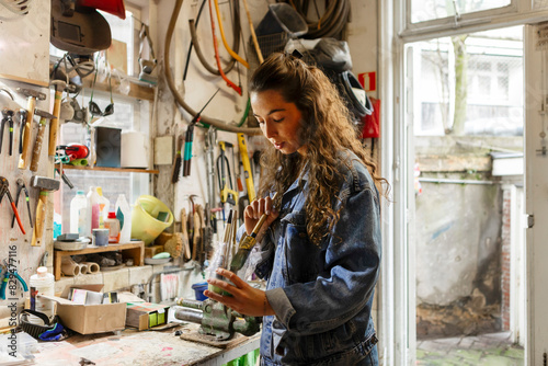 Carpenter choosing tools standing in workshop photo