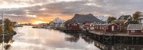 Reflection of Norwegian rorbu houses on fjord, Svolvaer, Austvagoy, Lofoten, Nordland County, Norway photo