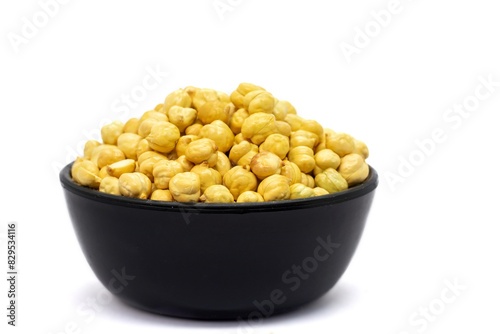 Roasted Chickpea or Garbanzo Bean in a Black Bowl Isolated on White Background with Copy Space, Also Known as Bengal Gram or Egyptian Pea