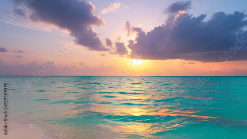 Sunset on the calm waters of the ocean off the coast of the Maldives. Sunset over the sea