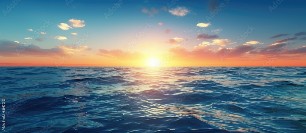 Fototapeta premium Sunset light illuminates the surface of the deep blue sea with a captivating view that offers a peaceful and tranquil setting for a copy space image