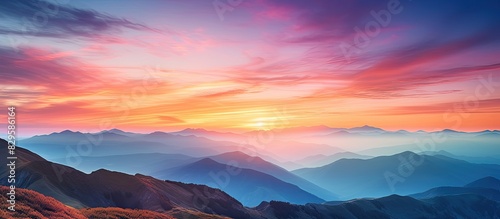 View of a stunning and colorful sunset in the mountains with a captivating copy space image