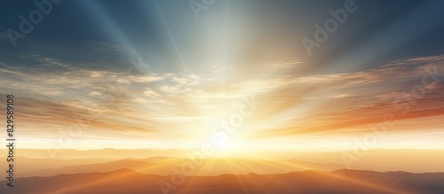 Soft daylight sky with long rays of sun casting a warm glow on the landscape creating a tranquil ambiance for a potential copy space image