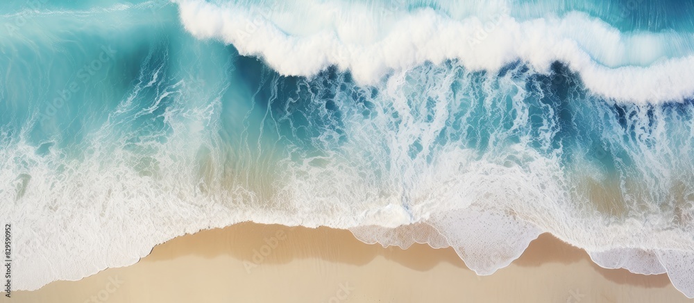 Aerial view of tropical beach surf with crashing waves showcasing an abstract ocean scene with copy space image Aerial view of tropical beach surf with crashing waves showcasing an abstract ocean scene with copy space image
