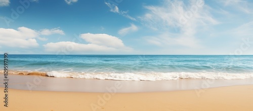 Beach scene with clear blue skies and golden sand perfect for a copy space image photo