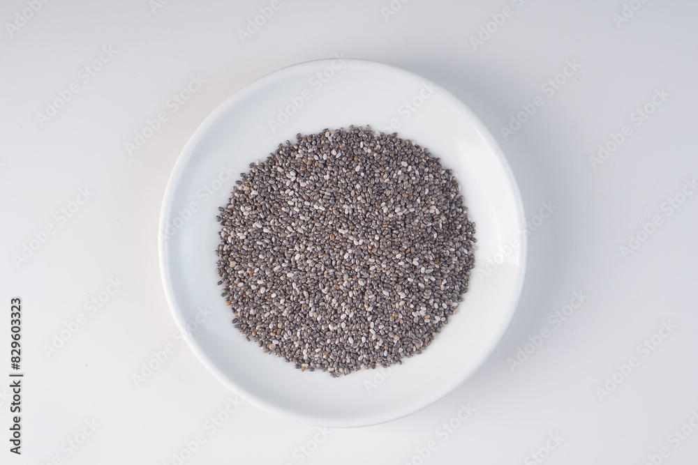 chia seeds in a bowl over a white background with studio lighting chia seeds in a bowl over a white background with studio lighting
