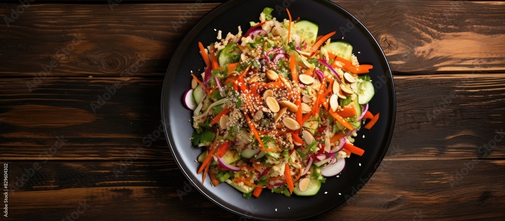 A healthy vegan concept featuring a fresh cabbage salad with organic vegetables and sesame seeds on a ceramic plate Presented on a wooden background in a top view flat lay style highlighting a copy sp A healthy vegan concept featuring a fresh cabbage salad with organic vegetables and sesame seeds on a ceramic plate Presented on a wooden background in a top view flat lay style highlighting a copy sp