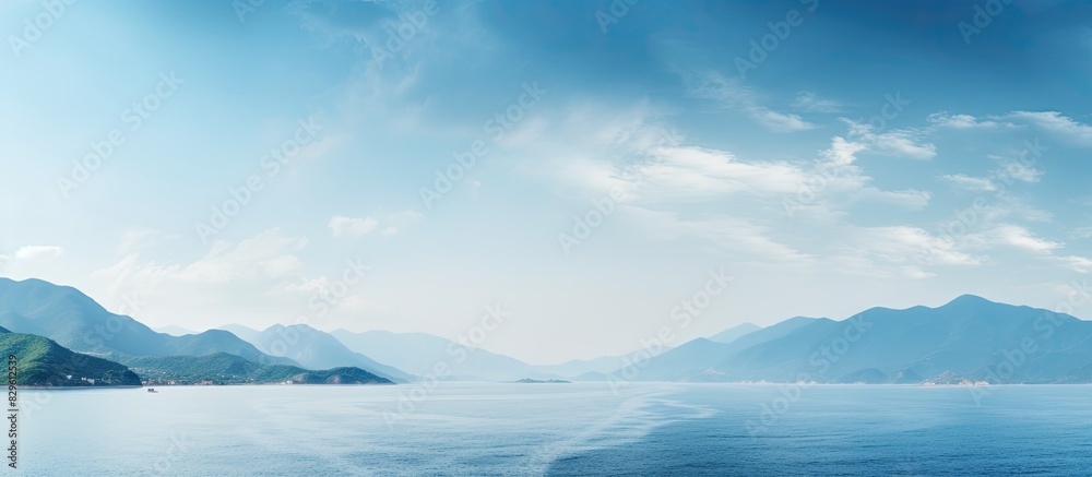 Scenic view of the sea and mountains with a copy space image