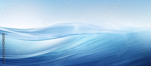 An abstract background with a medium wave texture in shades of blue resembling a serene sea provides a copy space image