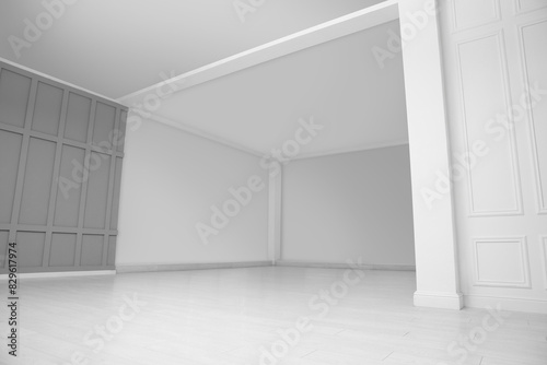 Empty room with grey wall and laminated floor