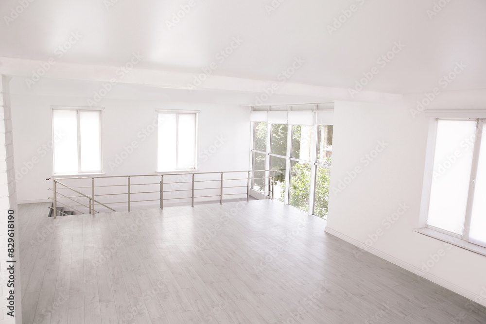 Fototapeta premium Empty room with windows and laminated floor