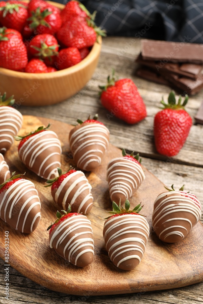 Delicious chocolate covered strawberries on wooden table Delicious chocolate covered strawberries on wooden table