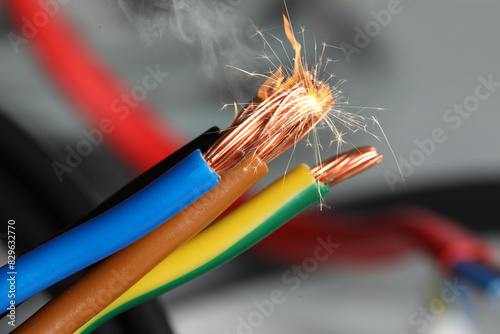 Canvas Print Sparking wiring on blurred background, closeup view